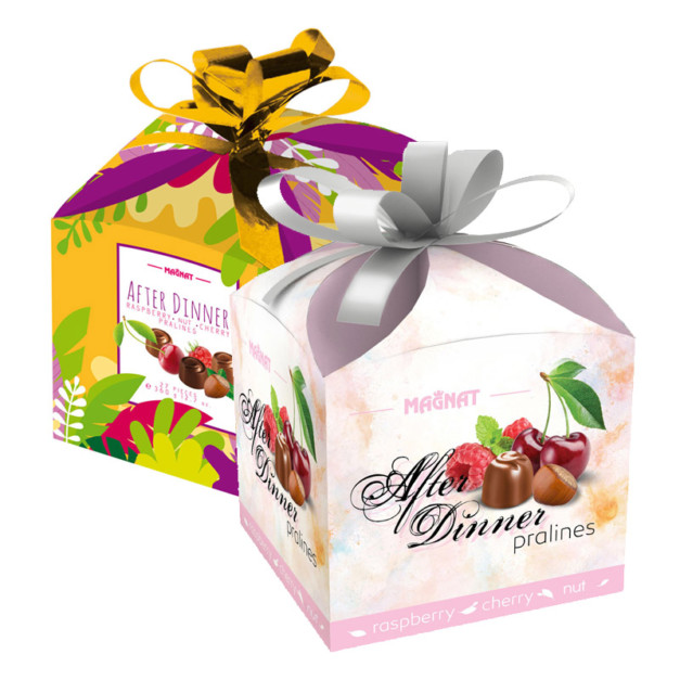 Chocolate pralines mix in a gift box with a bow